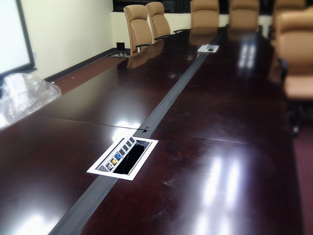 Conference table with integrated power and data connections
