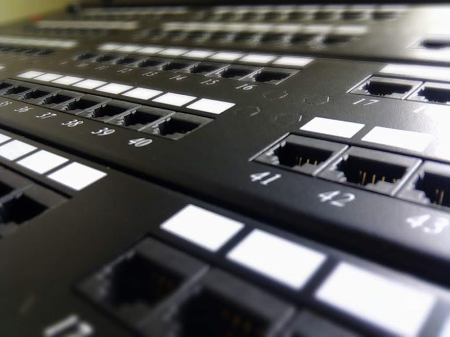 Close-up of labeled Ethernet patch panel ports